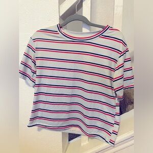 Red white and blue striped t-shirt.